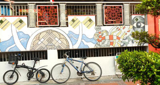 Two bikes outside a Chinese Restaurant in Singapore